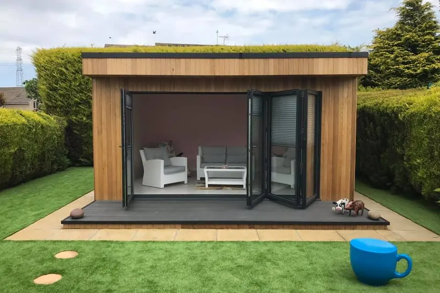 A bespoke garden room with bi-fold doors and a living sedum roof